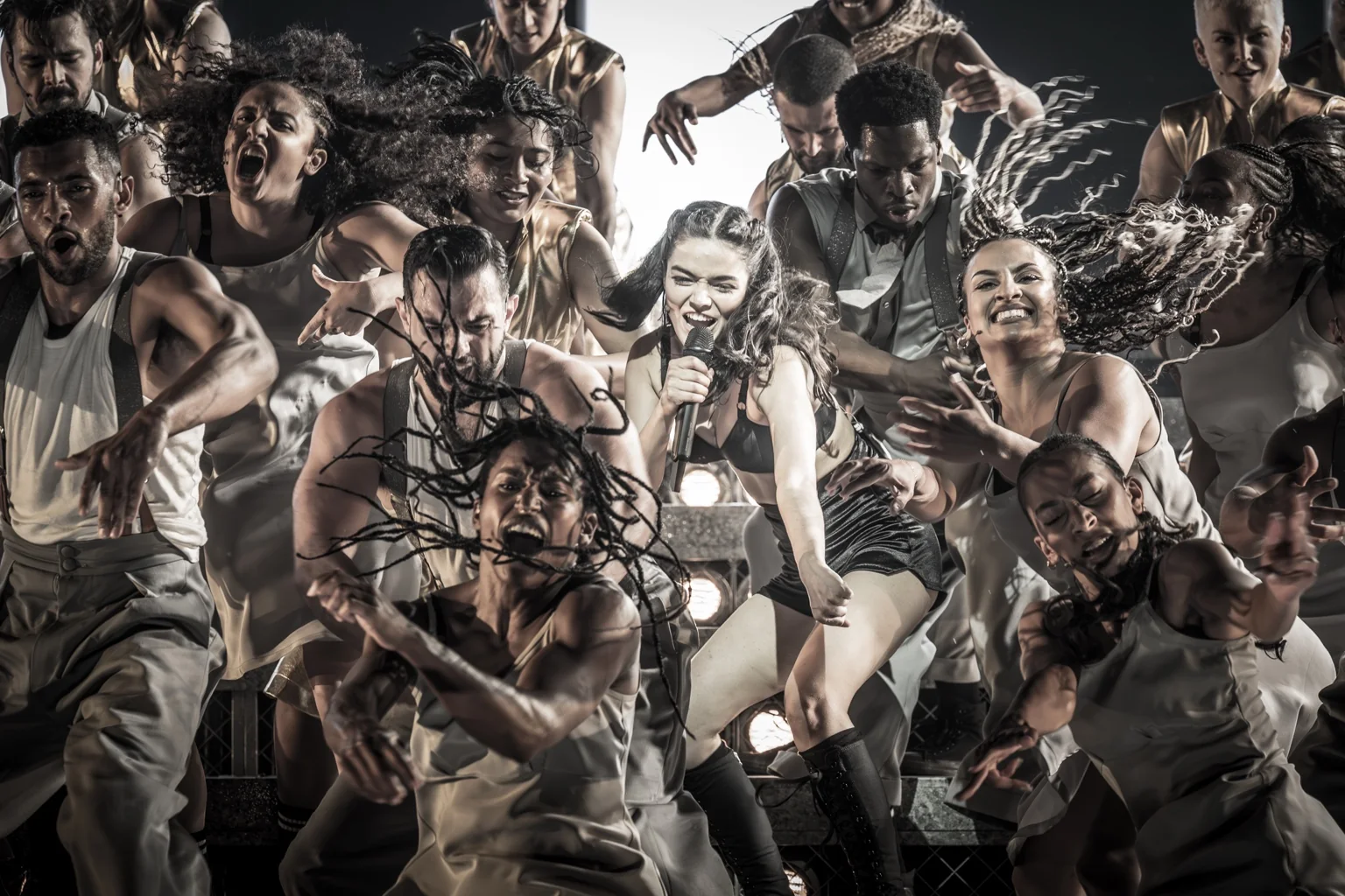 Rachel Zegler as Eva Perón performs with the company of Evita on the London Palladium stage.